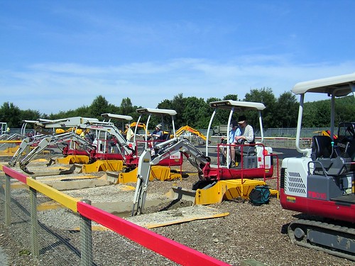 A line of heavy digger equipment at Diggerland USA.