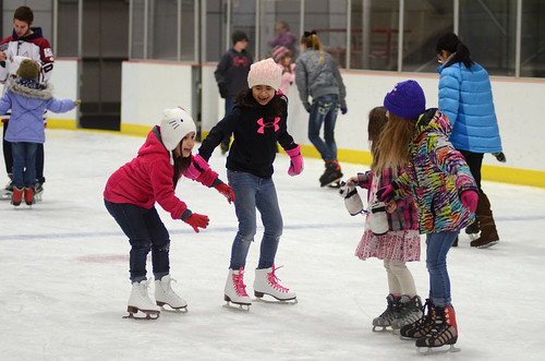 Girls having fun at the Fort Wainright Ice Rink.