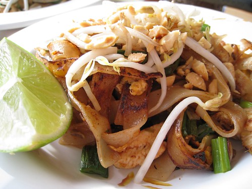 Freshly made Pad Thai with a lime wedge on the side.