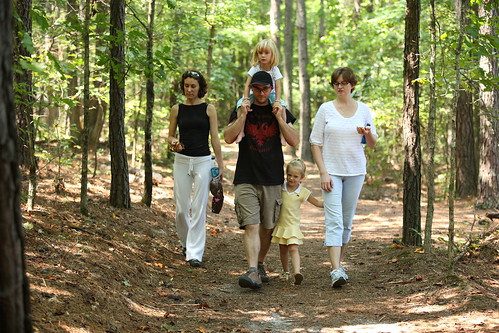 A family enjoying a walk in Tribble Mill Park around Peachtree, Georgia