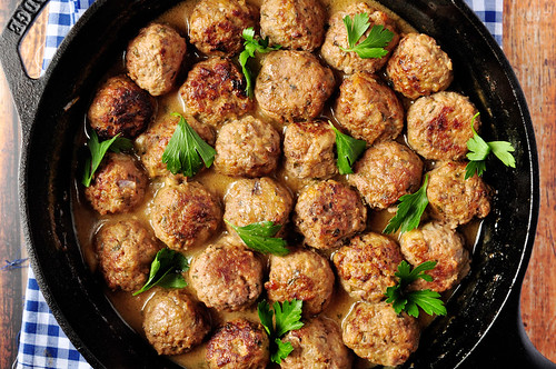 A cast-iron pan full of Swedish meatballs