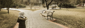 A young girl making her way down a walking path in Leawood Park in Leawood, Kansas.