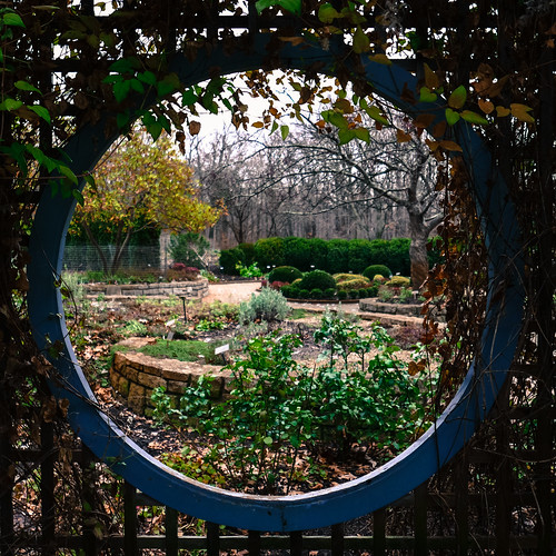 A circular view through a fence in the Inniswood Metro Garden.