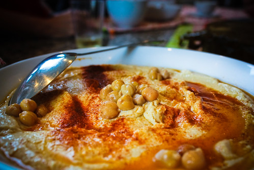 A close-up of a bowl of freshly made Hummus.