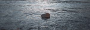 A rock sits in a waterway in North Las Vegas, Nevada