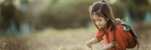 A young girl plays in the sand in Chanhassen, MN