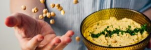 A person making hummus at a plant based restaurant near Thornton, CO