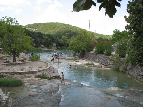 People swimming in the river at Turner Falls Park near Colleyville, TX