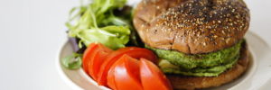 A plant-based burger with side salad for a healthy dinner