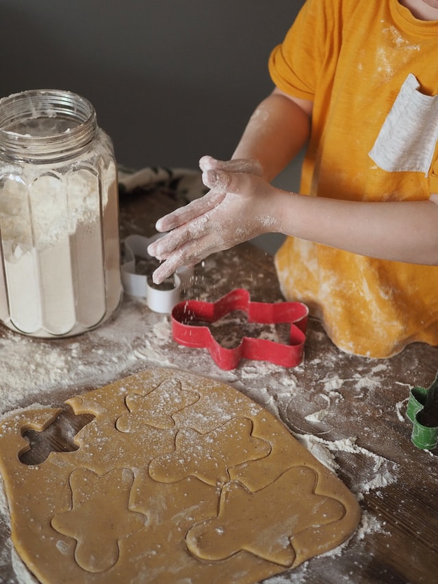A child making Christmas cookies at a kids cooking class in Westmont, IL