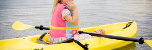 A young girl rides in a kayak on a waterway near Chester, OH