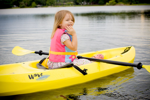 A young girl rides in a kayak on a waterway near Chester, OH