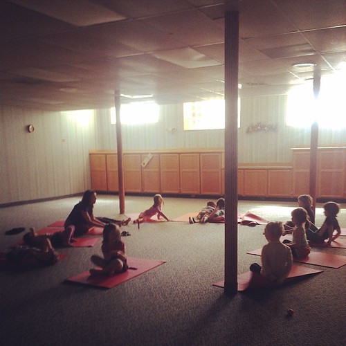 A group class enjoys a yoga class near Cedar Park, TX