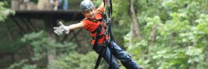 A boy enjoys ziplining in Lone Tree, Colorado