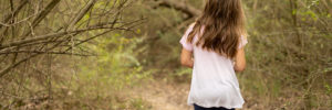 A girl takes a hike through the woods in Alpharetta, GA