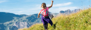 A young girl walks up a hill while hiking in Peoria, Arizona