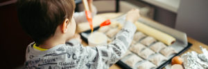 A young boy helps prepare pastries at a cooking class in Coppell, TX