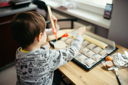A young boy helps prepare pastries at a cooking class in Coppell, TX