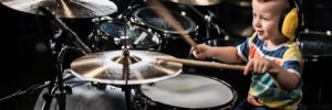 A child plays the drums at a music class in Centennial, Colorado