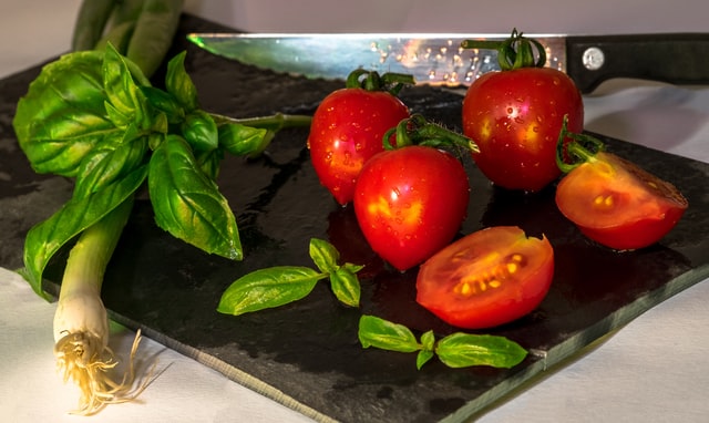 Tomatoes and basil being prepared at a plant-based restaurant in Westmont, Illinois