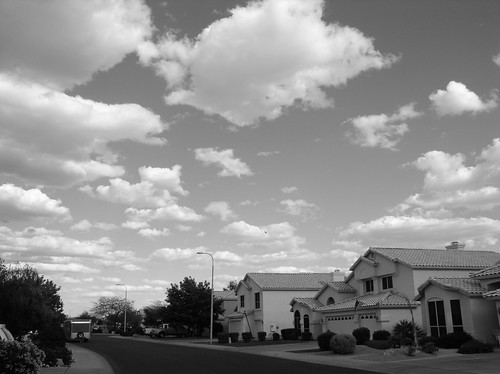 A black and white view of a street of houses on a gloomy day in Chandler, Arizona