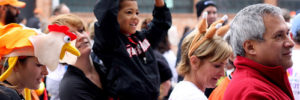 A father holds up his son at an annual Thanksgiving event in Coppell, Texas