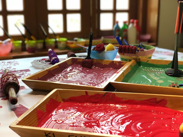 Plates of paint are ready for finger painting on a rainy day in Alpharetta, Georgia