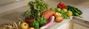 Fruits and vegetables from a CSA box in Carmel, Indiana set out on the counter