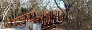 The "Current Drift" bridge art installation sits above Cottonwood Creek in Allen, Texas