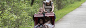 A woman takes her two children for a hike near Chanhassen, Minnesota