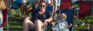 Families prepare their chairs for a concert in the plaza, a free thing to do in Colleyville, Texas