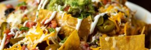 A plate of nachos served at a restaurant serving international cuisine in Frisco, Texas