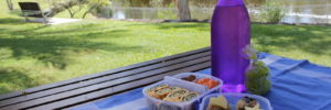 A table is prepared next to the river for a picnic in Westerville, Ohio