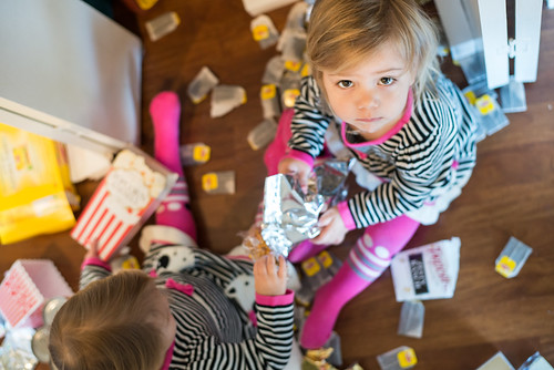 A child plays with her sister as part of a positive parenting exercise