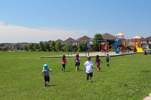 Kids burn energy at a park in Fishers, Indiana