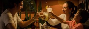 Parents enjoy a meal with their child at a family-friendly restaurant in Bridgewater, New Jersey