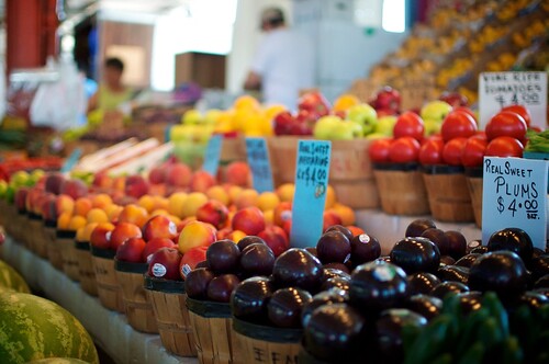 Fruits and vegetables line tables at a farmers market in Thornton, Colorado
