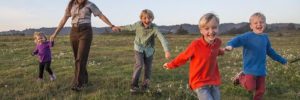 Kids run around a nature center as part of a local club in Romeoville, Illinois