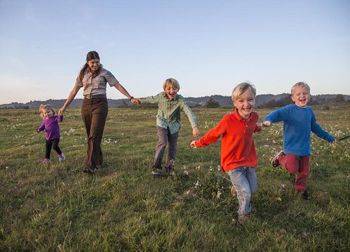 Kids run around a nature center as part of a local club in Romeoville, Illinois