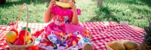A young girl enjoys a banana at a picnic spot in Peoria, Arizona