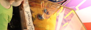 A kid enjoys pin ball as a rainy day activity in Las Vegas, Nevada