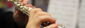 Child playing the flute in a music class in Woodbridge, VA