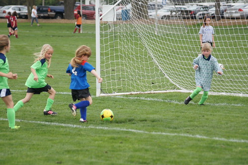 Kids playing organized sports soccer.