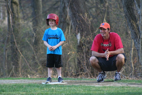 Father and son participating in a baseball game in Woodbridge, VA.