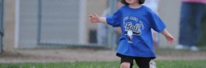 Small boy running the bases in a Leawood, KS baseball game.