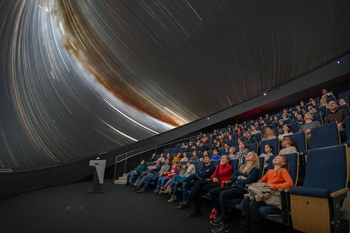 Crowd sitting inside a planetarium in New Jersey