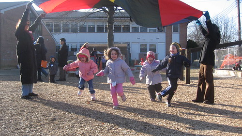 Children playing on a pre-kindergarten playground.