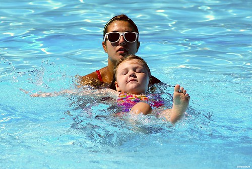 Child and mother learn to swim at a Peoria, AZ pool.