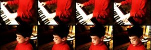 A boy playing piano in a Frisco, TX music class.