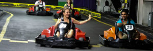 A young couple ride go-carts in Mount Laurel, NJ.